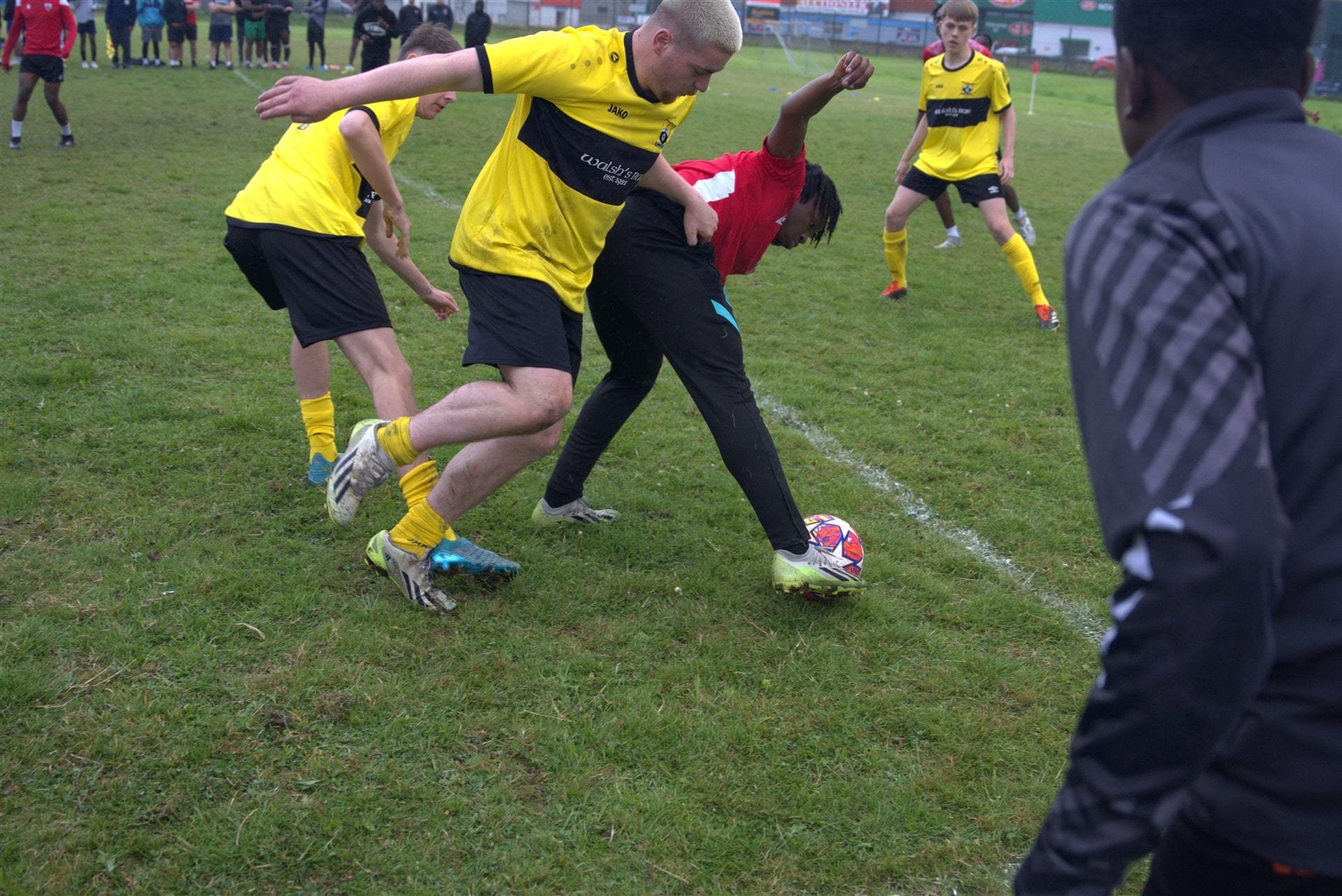 Athlone's Finest players in yellow kit in front of the watching crowd